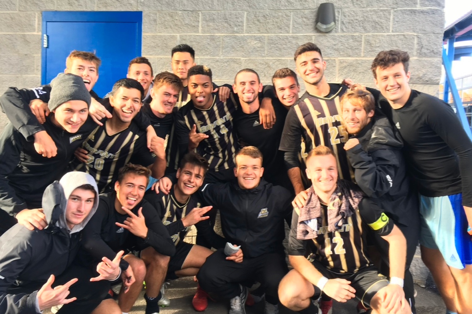 The Pathwai founder celebrating with his Bryant University soccer teammates